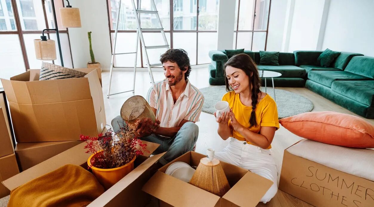 A couple unpacking some of their possessions after moving